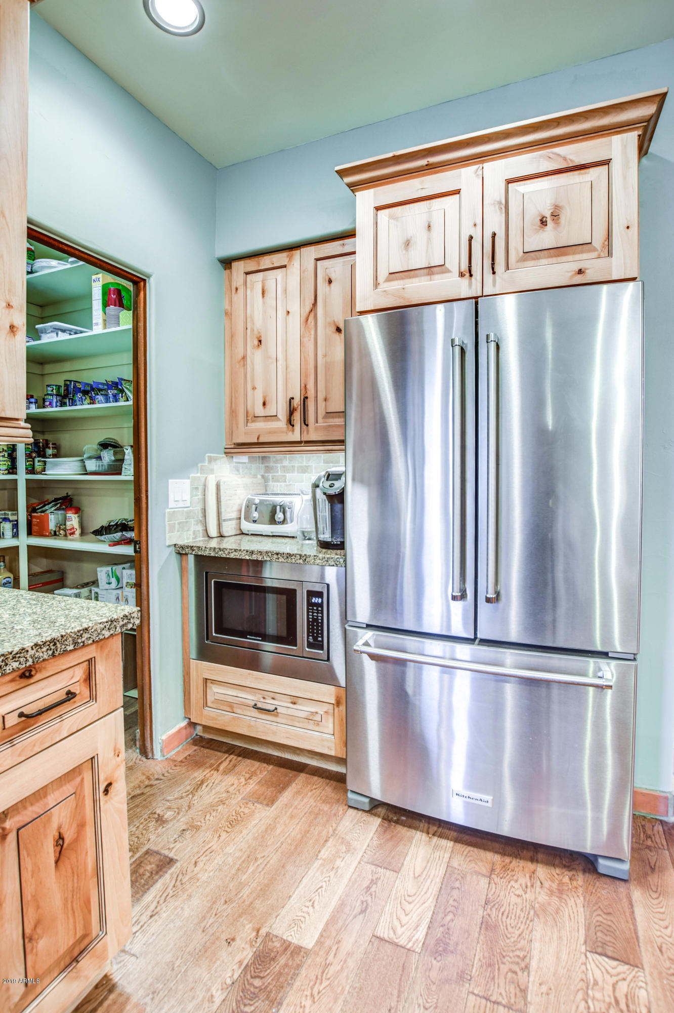 3530 North Hawes Road, Unit 10 Mesa, AZ 85207 - Photo 19 of 76 a kitchen with granite countertop a refrigerator and a stove top oven