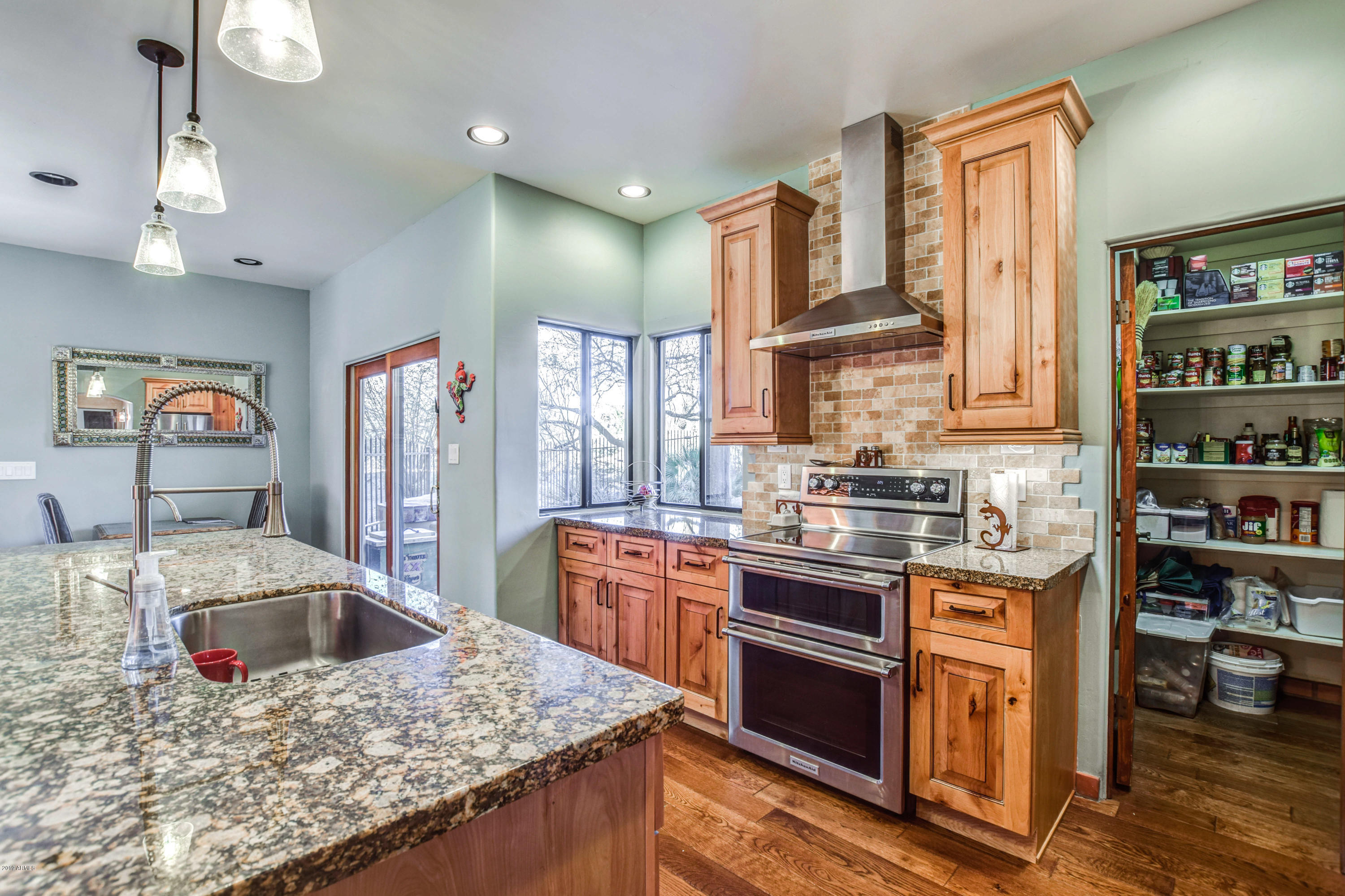 3530 North Hawes Road, Unit 10 Mesa, AZ 85207 - Photo 20 of 76 a kitchen with stainless steel appliances granite countertop a sink stove and refrigerator