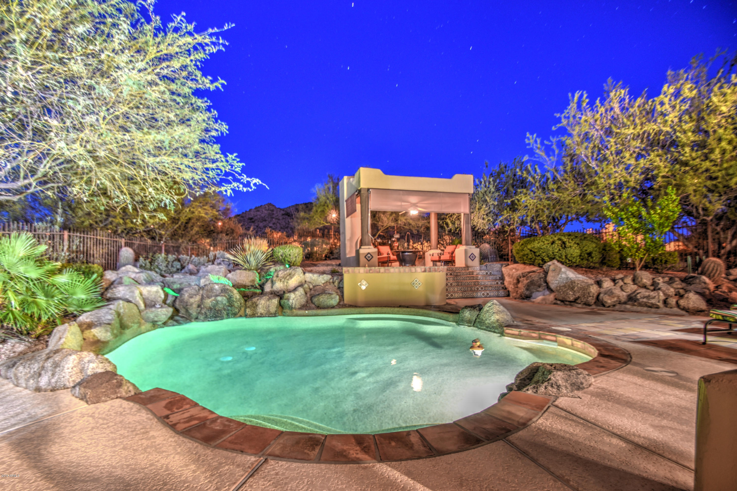 3530 North Hawes Road, Unit 10 Mesa, AZ 85207 - Photo 2 of 76 a view of a swimming pool with a yard
