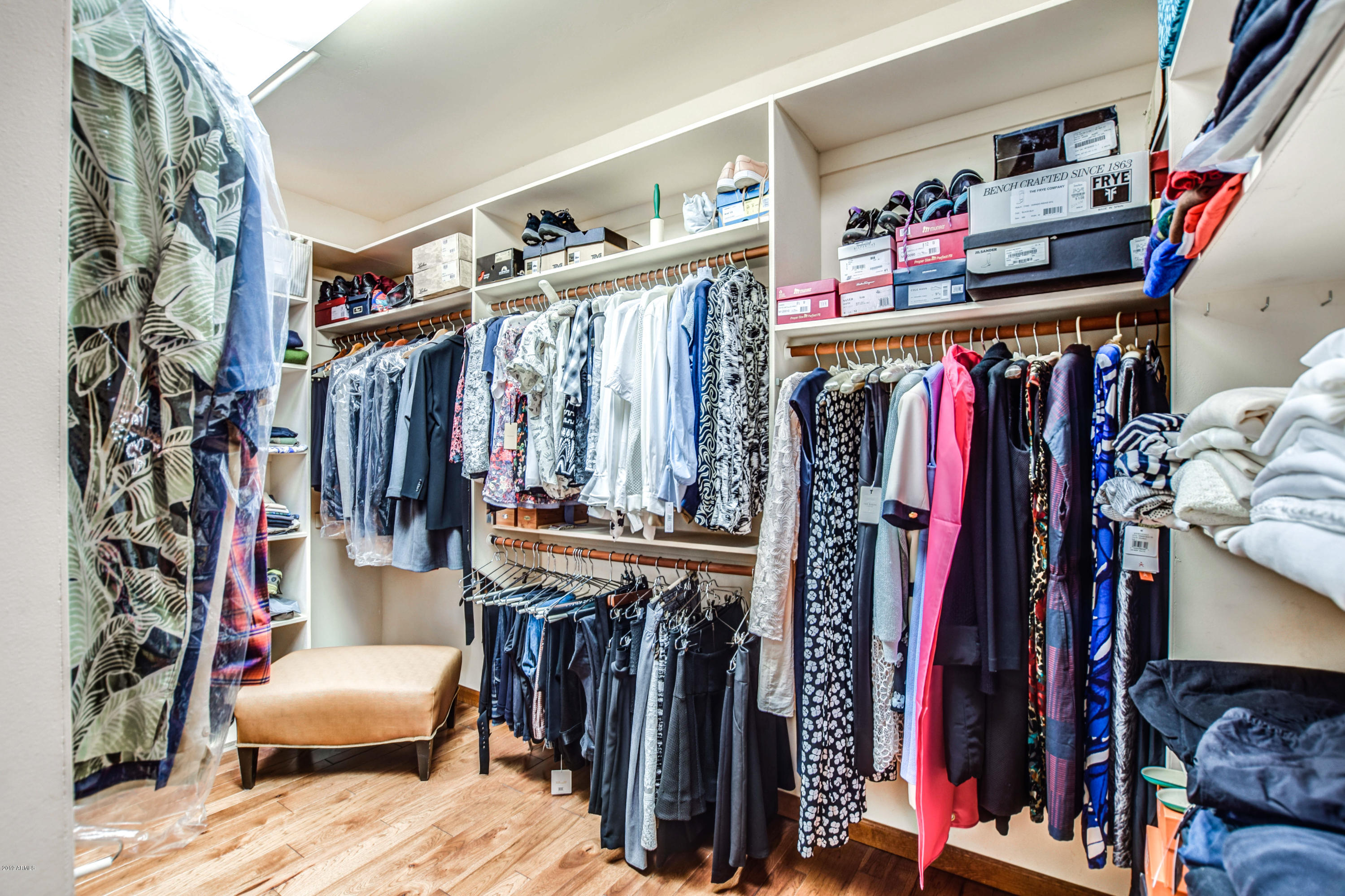 3530 North Hawes Road, Unit 10 Mesa, AZ 85207 - Photo 25 of 76 a view of walk in closet with clothes and shoes