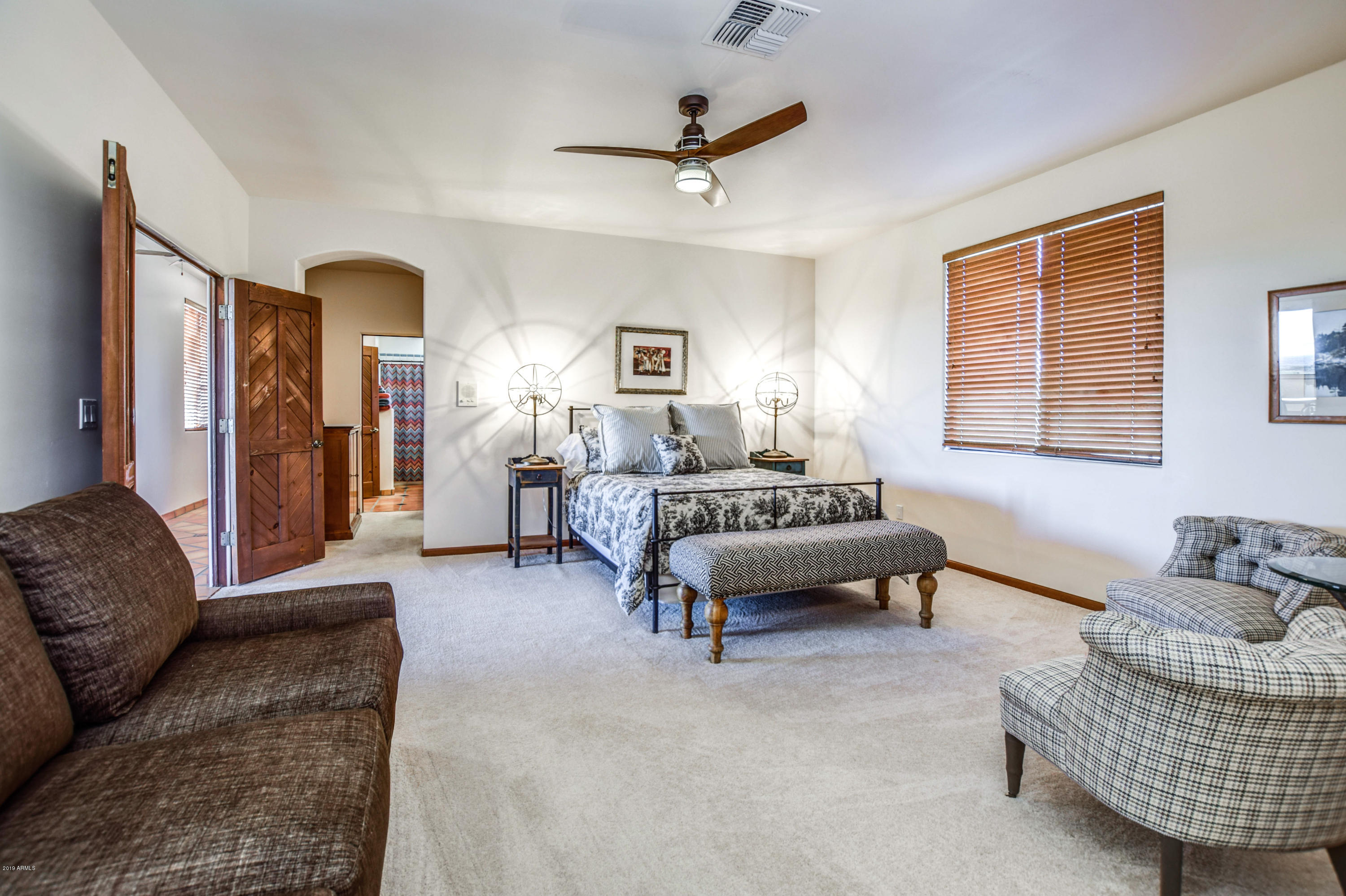 3530 North Hawes Road, Unit 10 Mesa, AZ 85207 - Photo 27 of 76 a living room with furniture rug and window