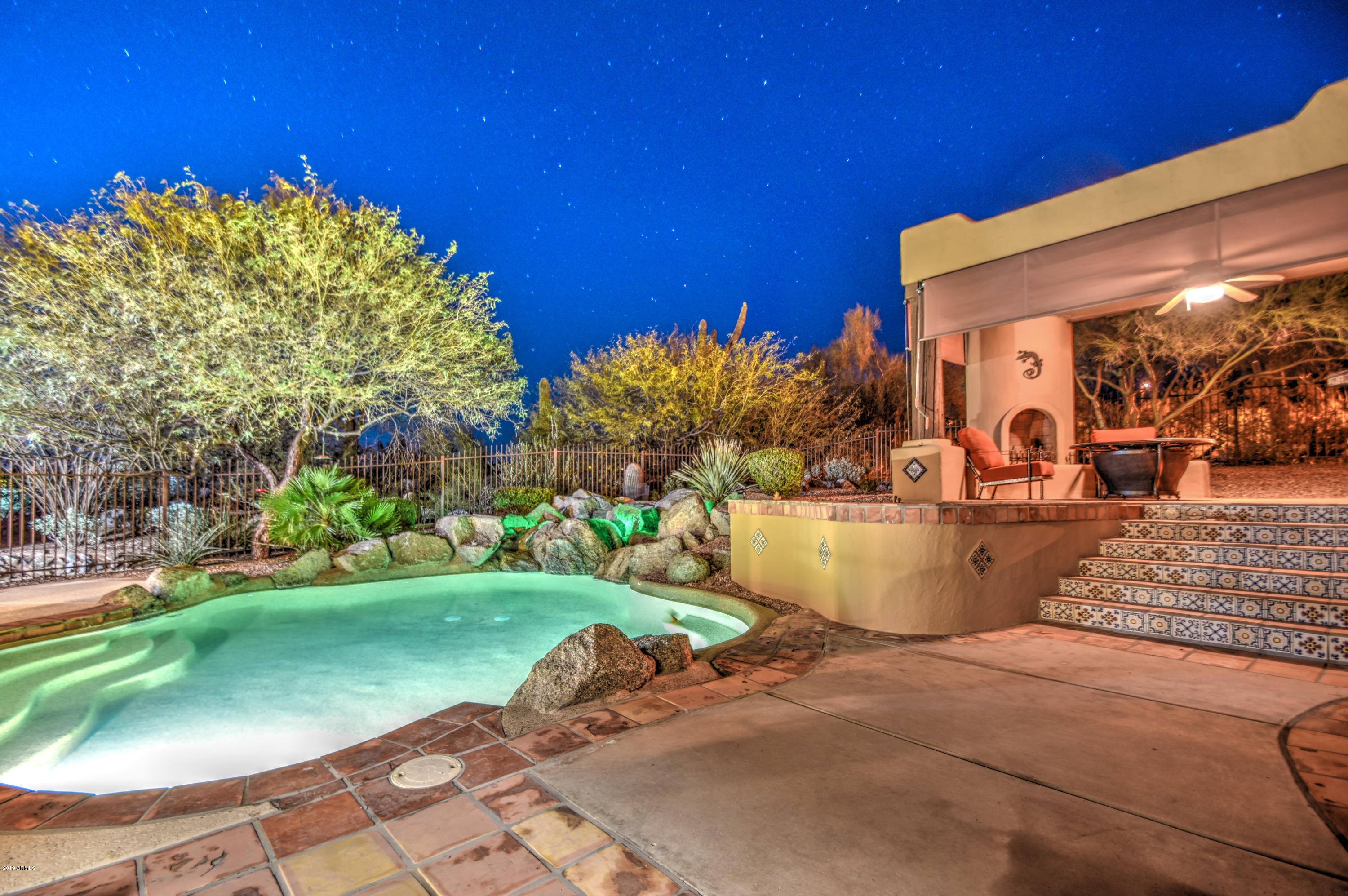3530 North Hawes Road, Unit 10 Mesa, AZ 85207 - Photo 3 of 76 a view of a swimming pool with a yard