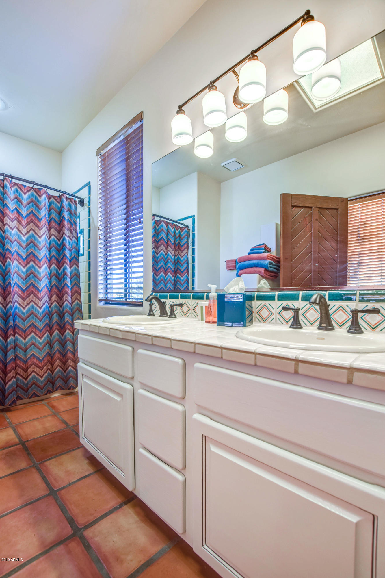 3530 North Hawes Road, Unit 10 Mesa, AZ 85207 - Photo 32 of 76 a bathroom with a sink and a mirror