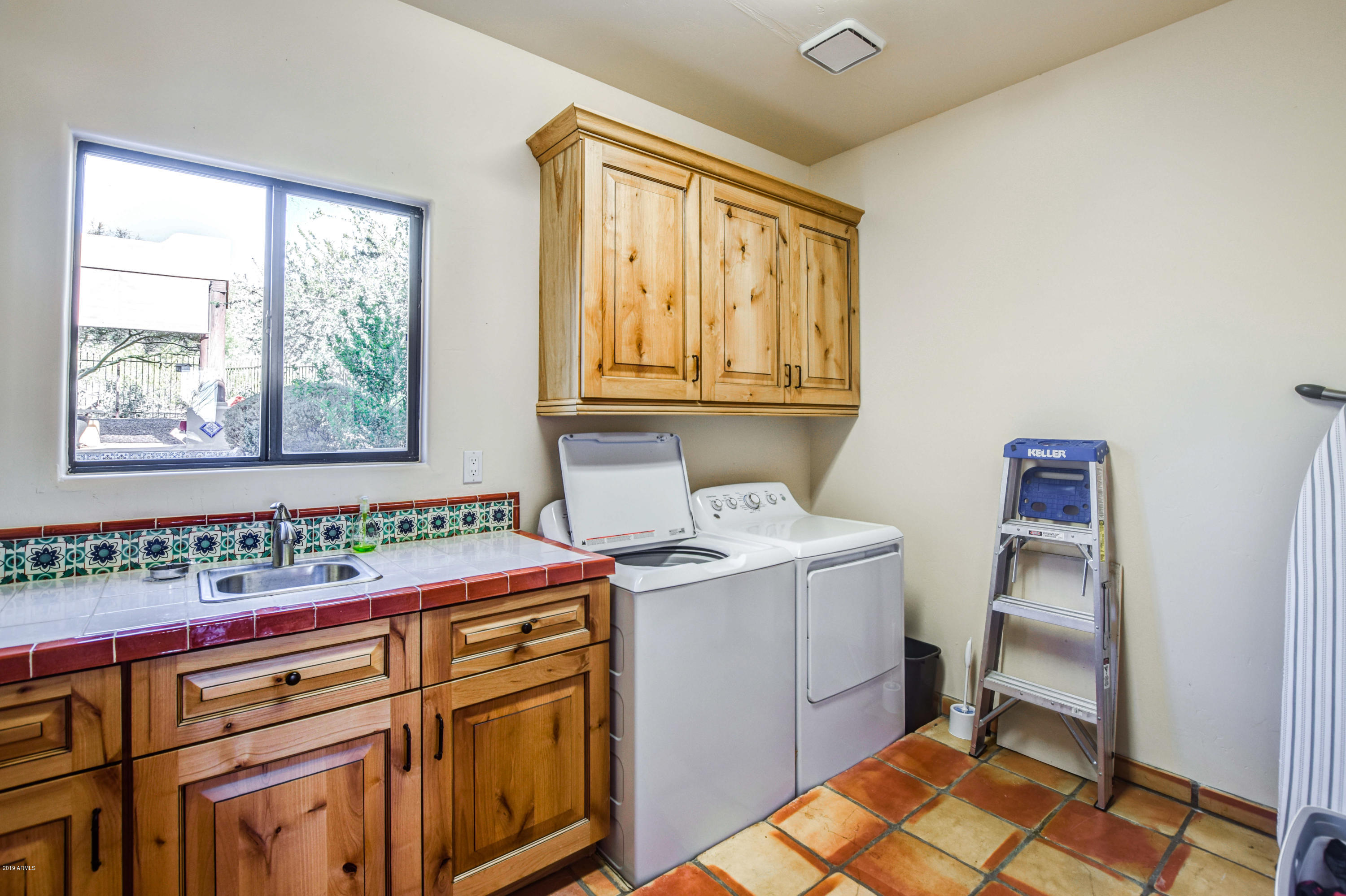 3530 North Hawes Road, Unit 10 Mesa, AZ 85207 - Photo 33 of 76 a utility room with a sink dryer and washer