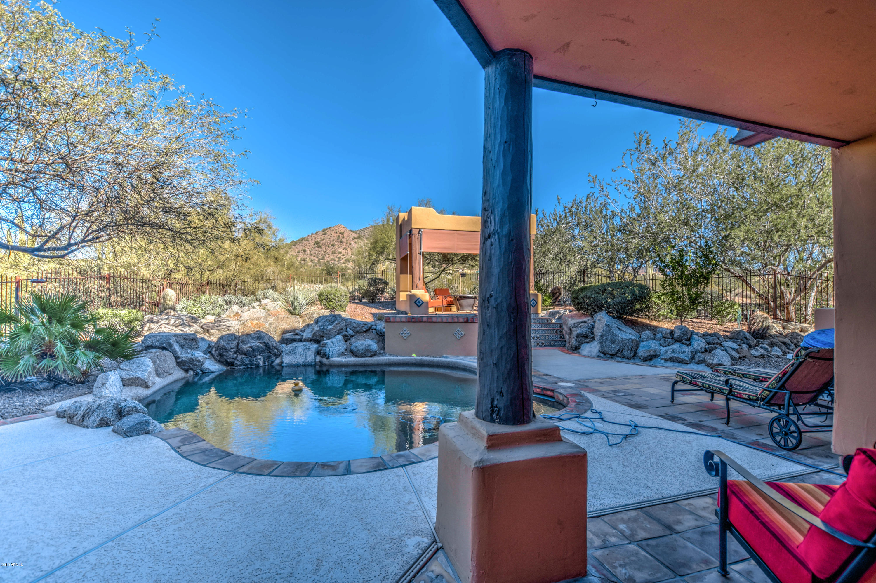 3530 North Hawes Road, Unit 10 Mesa, AZ 85207 - Photo 39 of 76 a view of a swimming pool with a patio