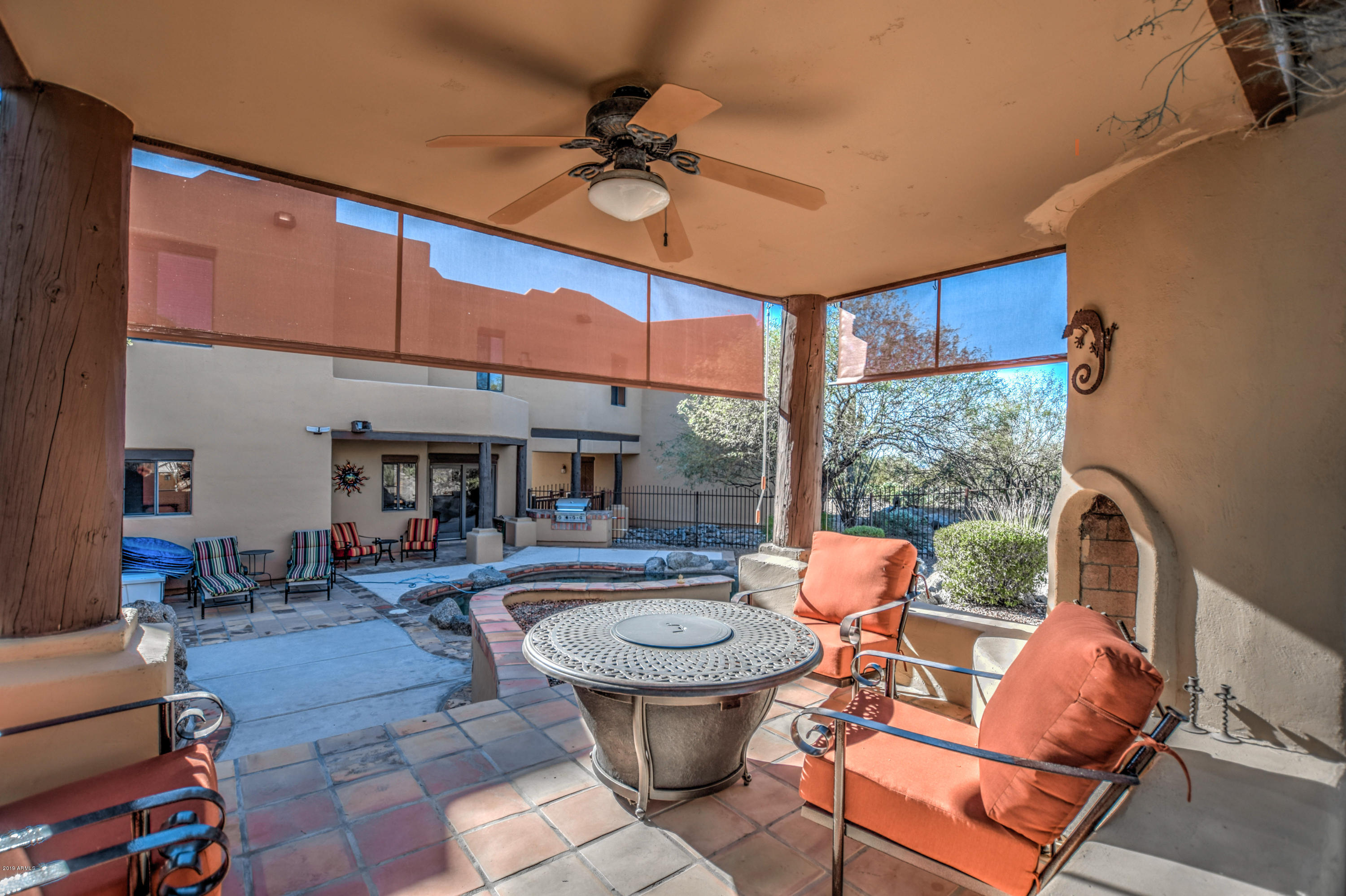 3530 North Hawes Road, Unit 10 Mesa, AZ 85207 - Photo 42 of 76 a living room with patio furniture and a fireplace
