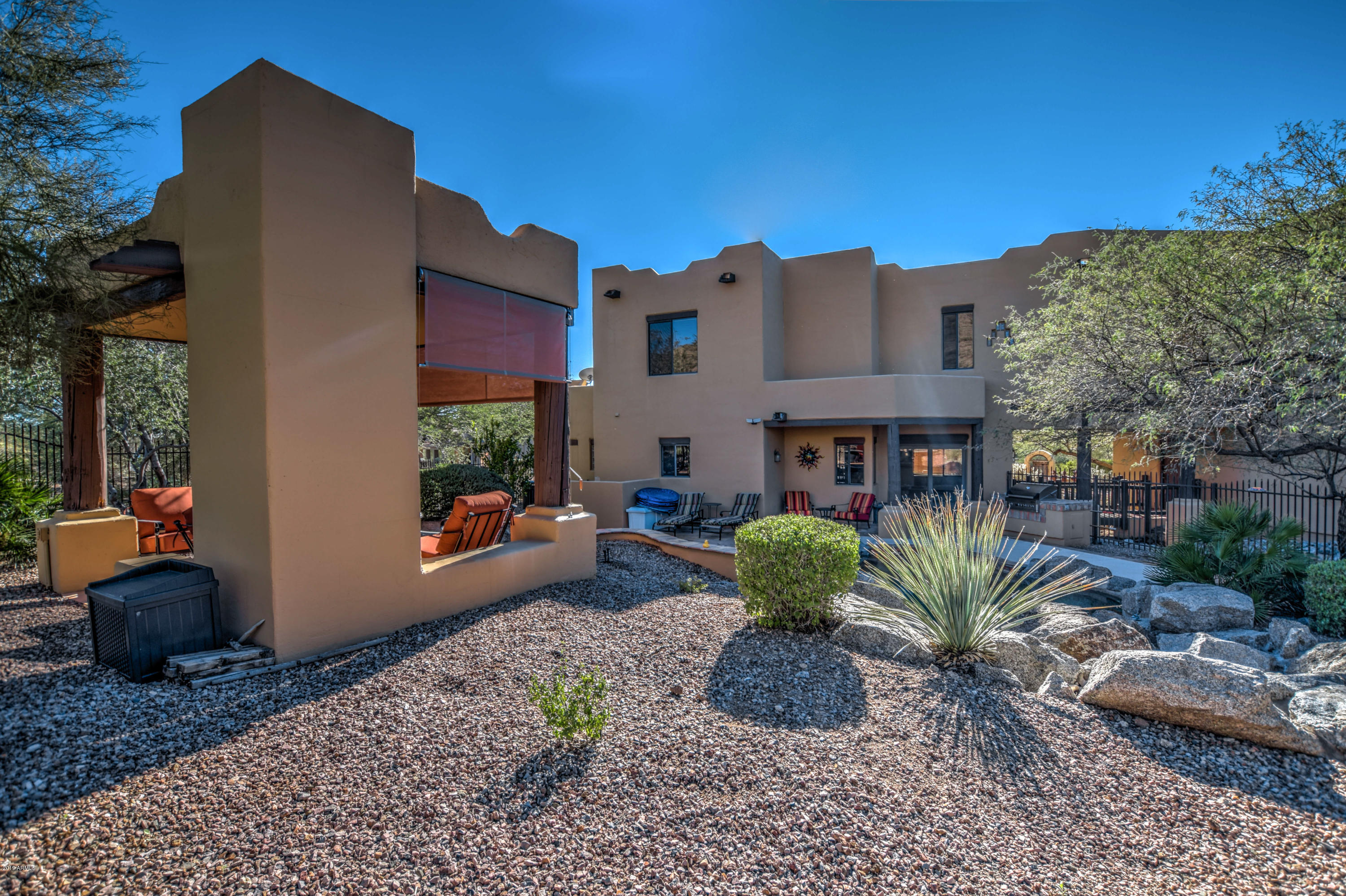 3530 North Hawes Road, Unit 10 Mesa, AZ 85207 - Photo 43 of 76 a front view of a house with garden and plants