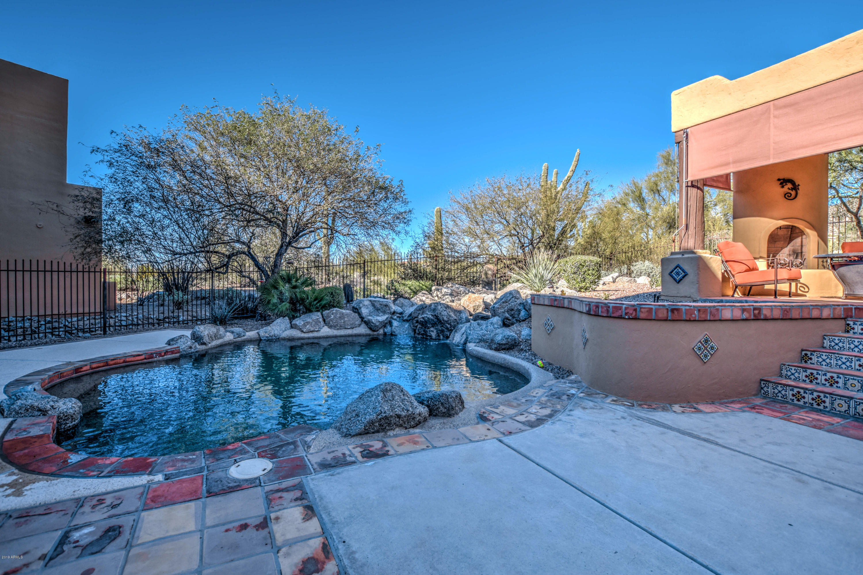 3530 North Hawes Road, Unit 10 Mesa, AZ 85207 - Photo 46 of 76 a view of a swimming pool with sitting area