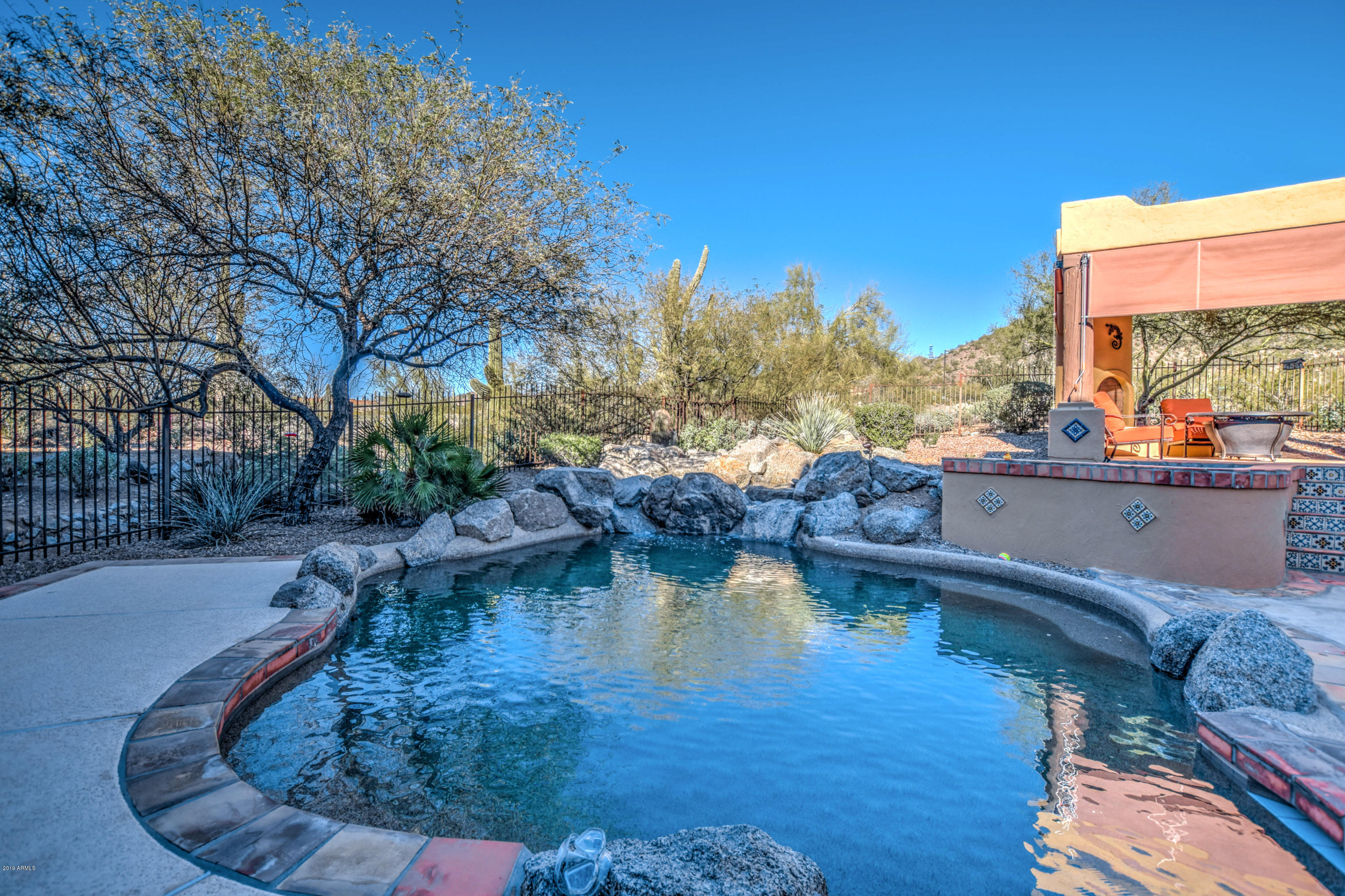 3530 North Hawes Road, Unit 10 Mesa, AZ 85207 - Photo 47 of 76 a view of a swimming pool with sitting area