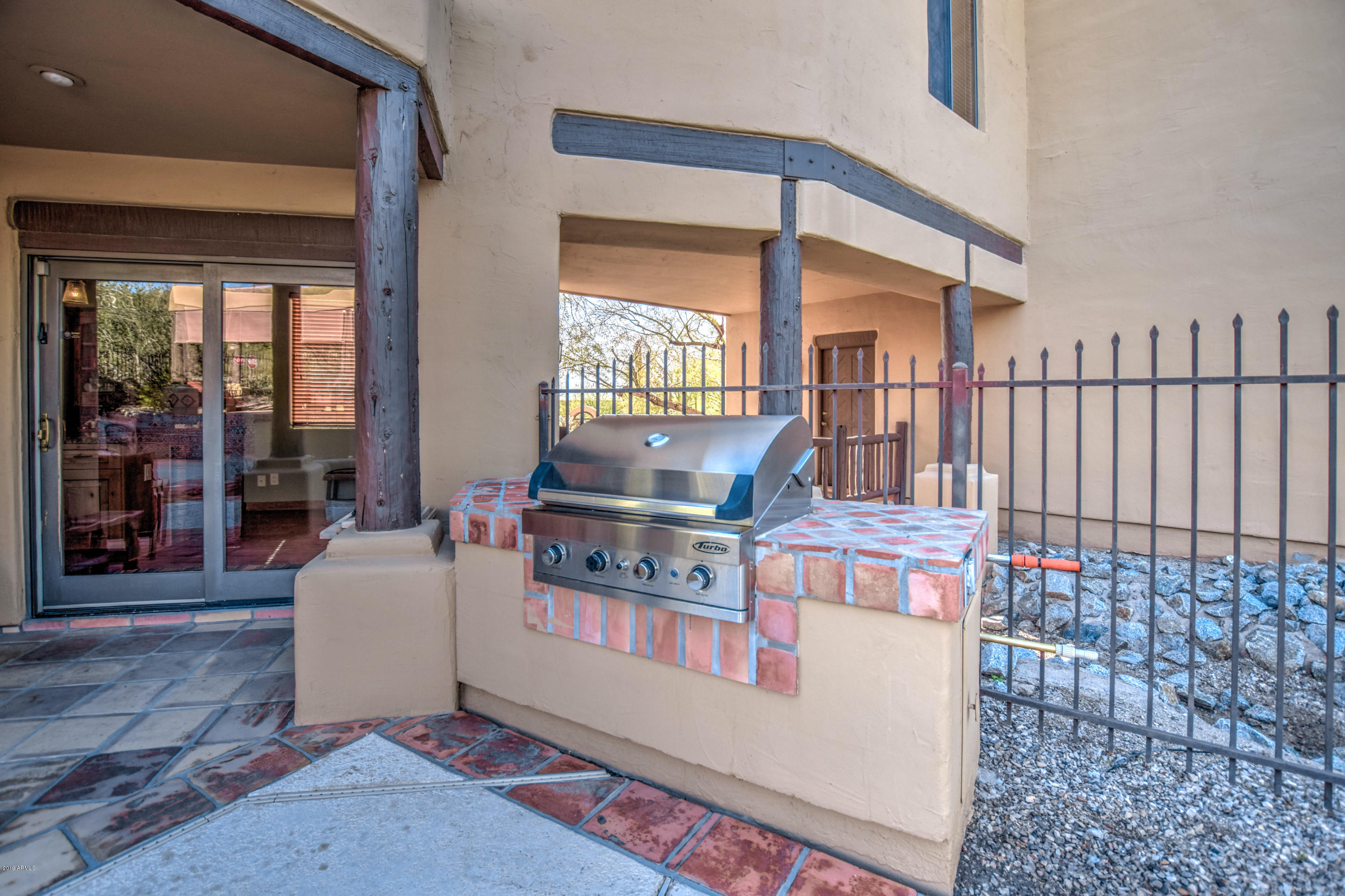 3530 North Hawes Road, Unit 10 Mesa, AZ 85207 - Photo 48 of 76 a living room with furniture a window and a fireplace