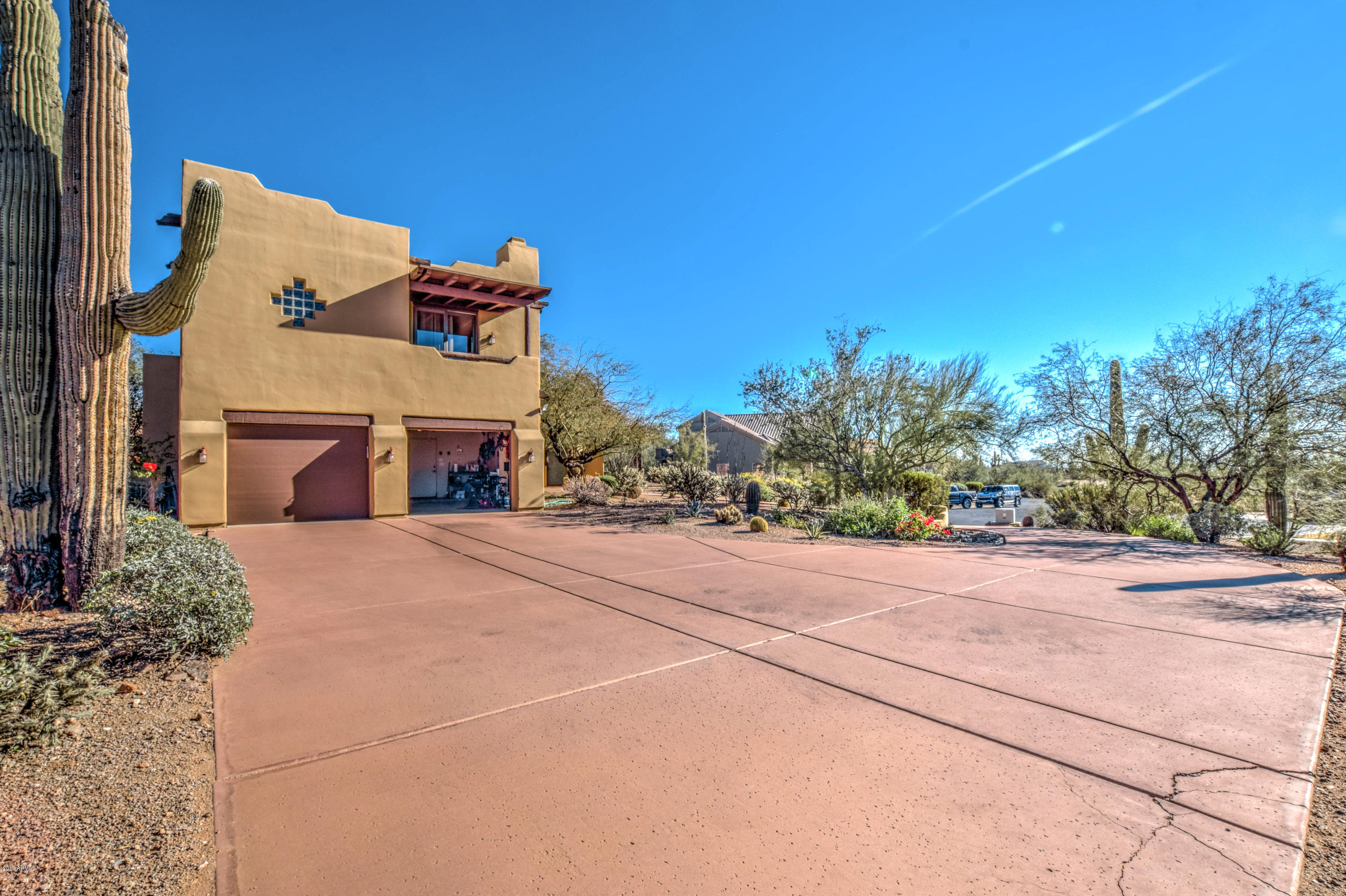 3530 North Hawes Road, Unit 10 Mesa, AZ 85207 - Photo 51 of 76 a front view of a house with a yard and garage