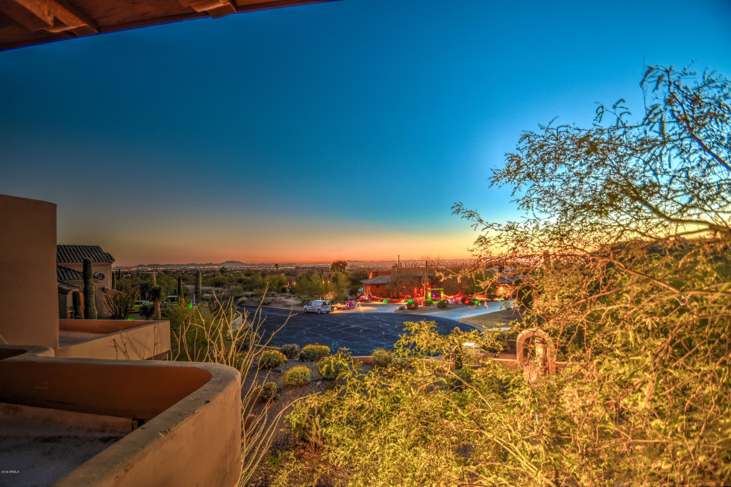 3530 North Hawes Road, Unit 10 Mesa, AZ 85207 - Photo 62 of 76 a view of a balcony with couches and city view