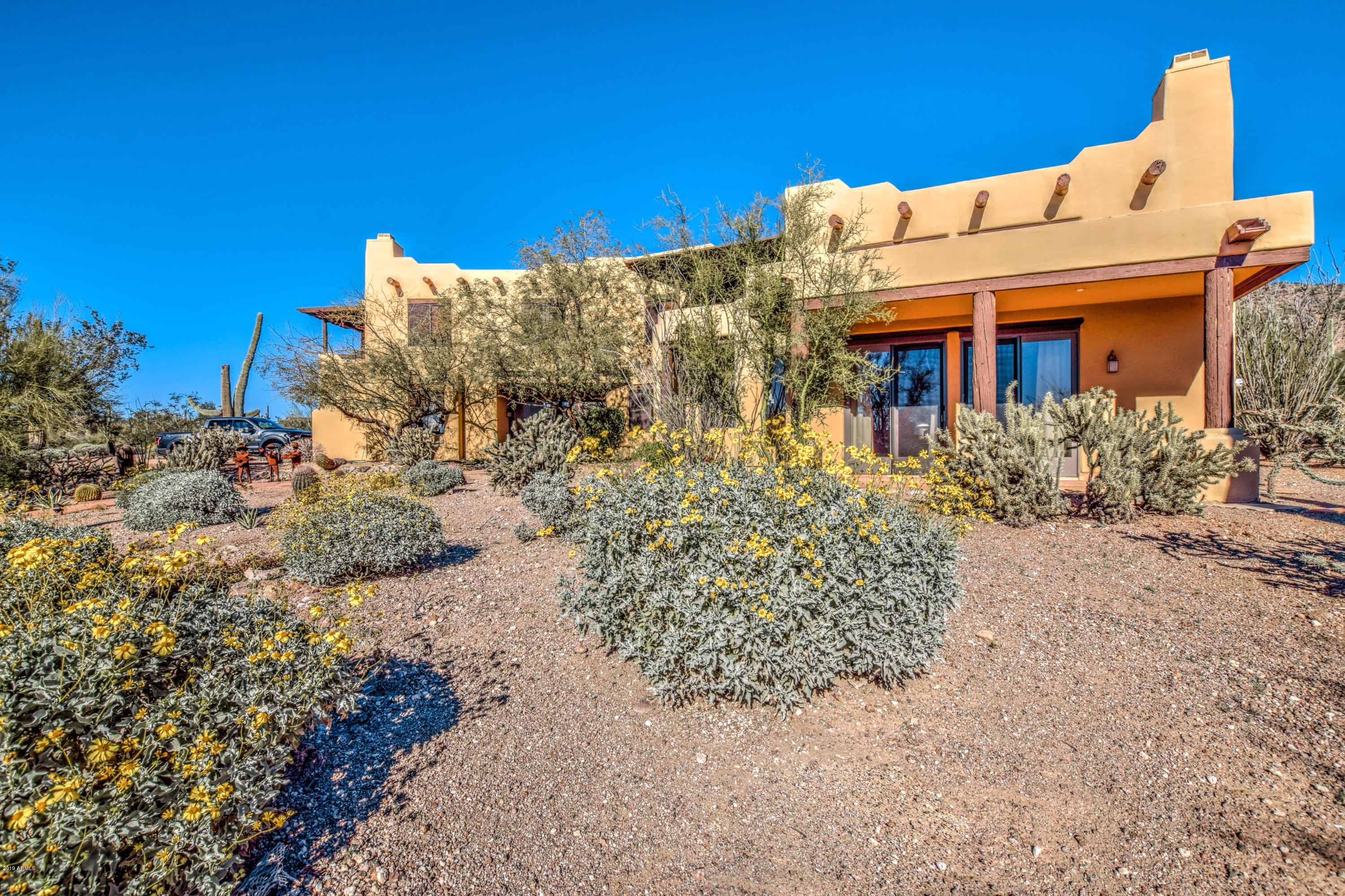3530 North Hawes Road, Unit 10 Mesa, AZ 85207 - Photo 7 of 76 a front view of a house with a yard