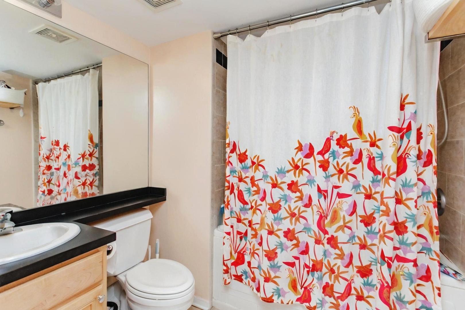 500 South Clinton Street, Unit 743 Chicago, IL 60607 - Photo 11 of 16 a bathroom with a toilet and a shower curtain
