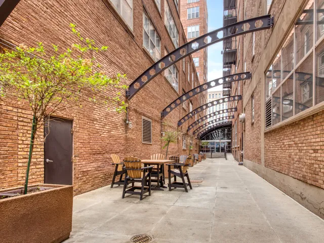 a view of a building with outdoor seating