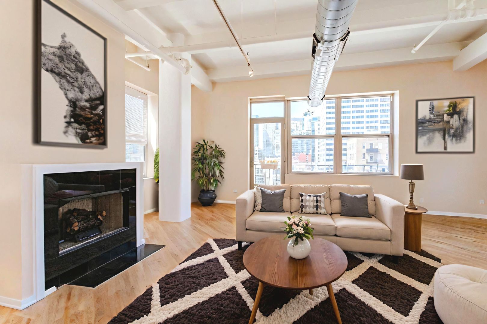 500 South Clinton Street, Unit 743 Chicago, IL 60607 - Photo 2 of 16 a living room with furniture and a fireplace
