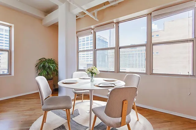 a dining room with furniture and window