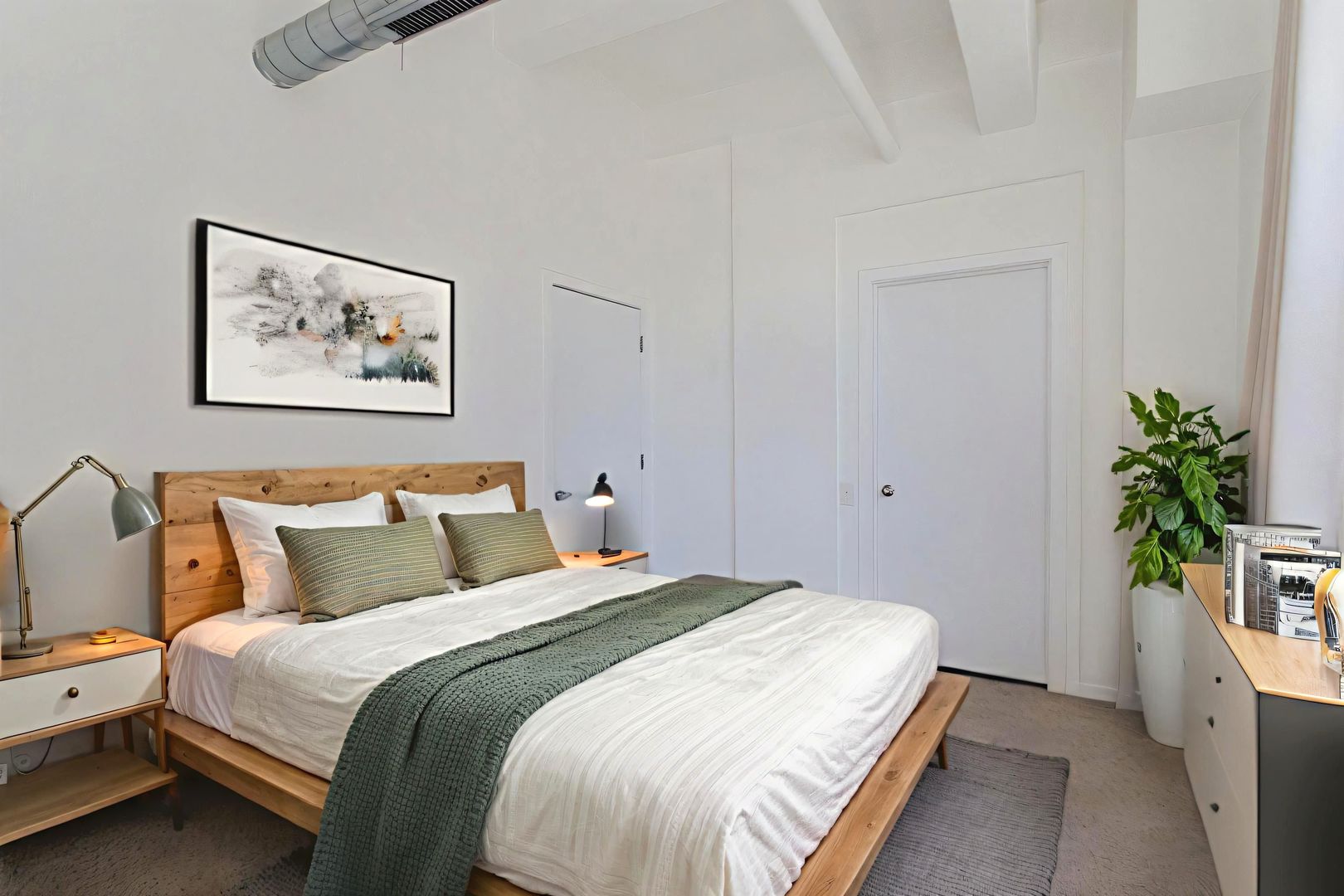 500 South Clinton Street, Unit 743 Chicago, IL 60607 - Photo 7 of 16 a bedroom with a bed and a potted plant