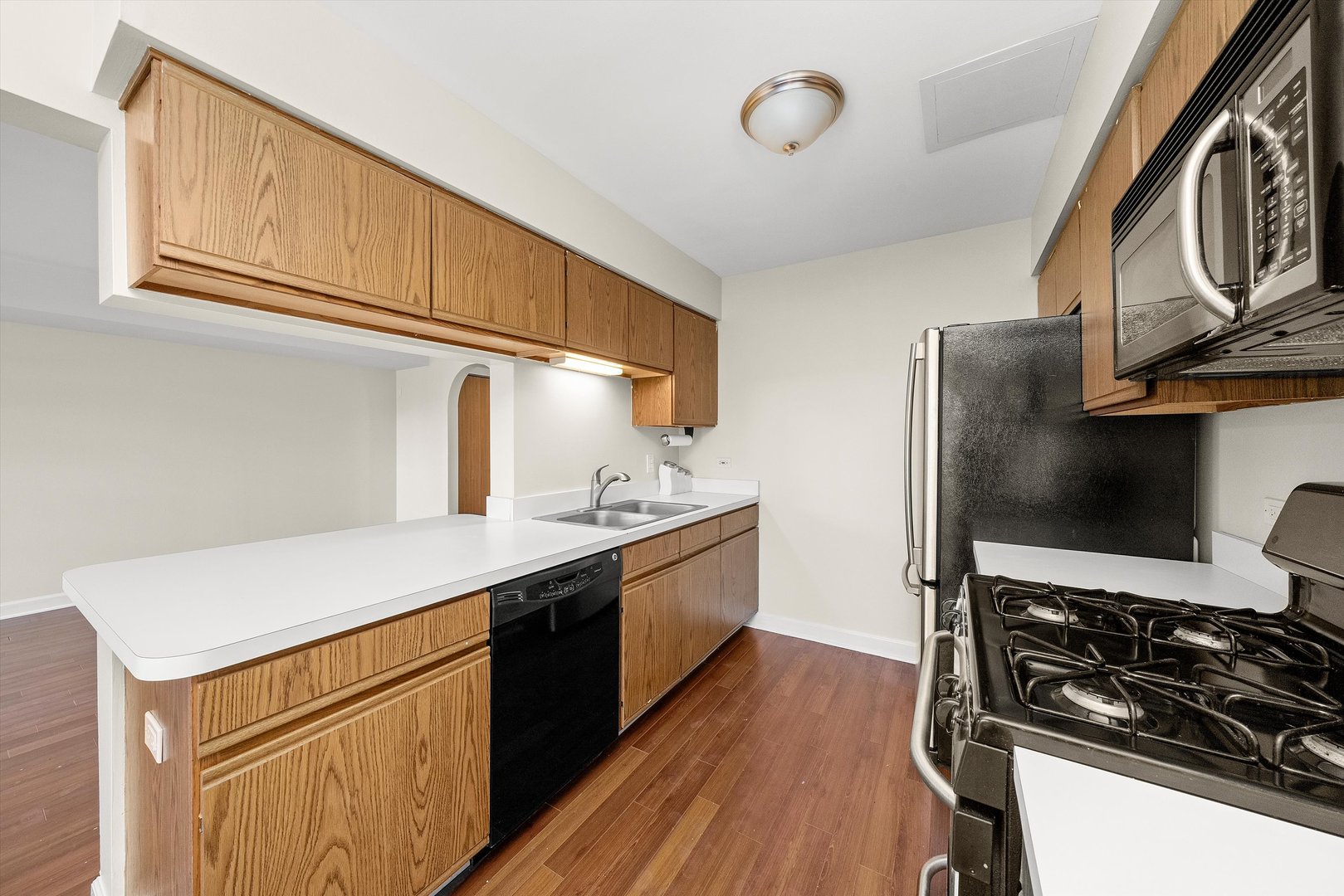 1862 Pebble Beach Circle Elgin, IL 60123 - Photo 11 of 26 a kitchen with stainless steel appliances a sink and a stove