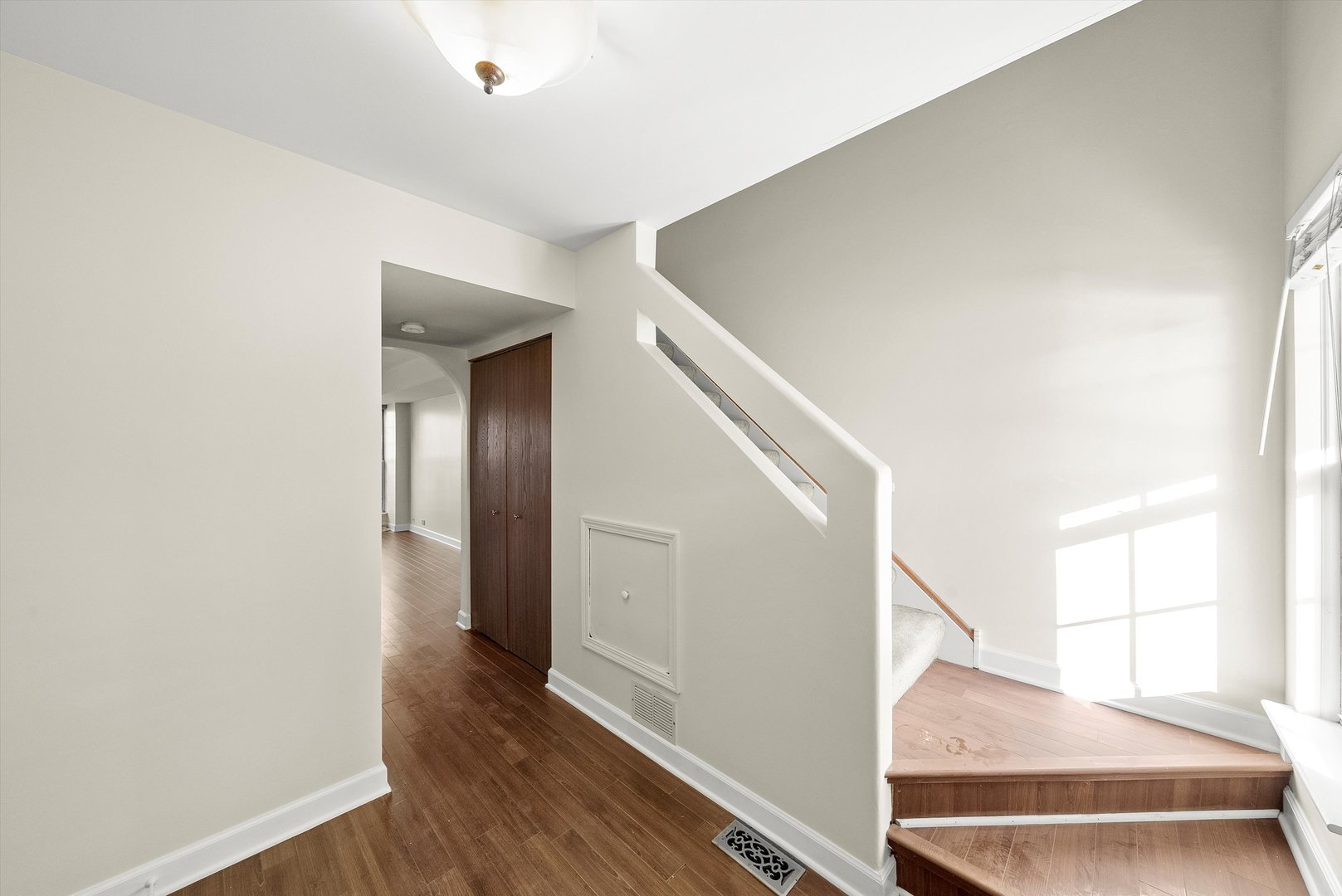 1862 Pebble Beach Circle Elgin, IL 60123 - Photo 12 of 26 a view of a hallway view with wooden floor and staircase