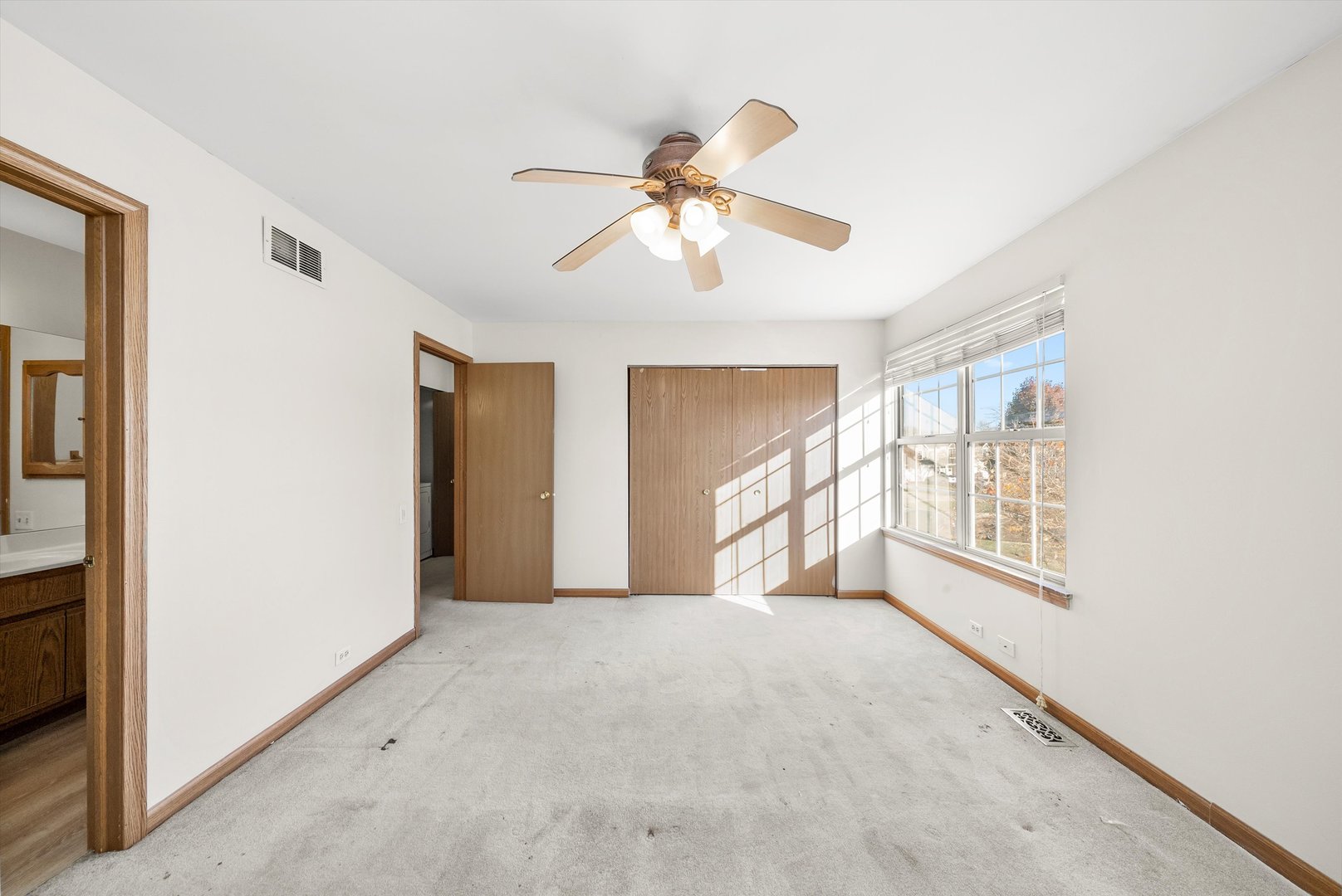 1862 Pebble Beach Circle Elgin, IL 60123 - Photo 14 of 26 a view of a livingroom with a ceiling fan and window