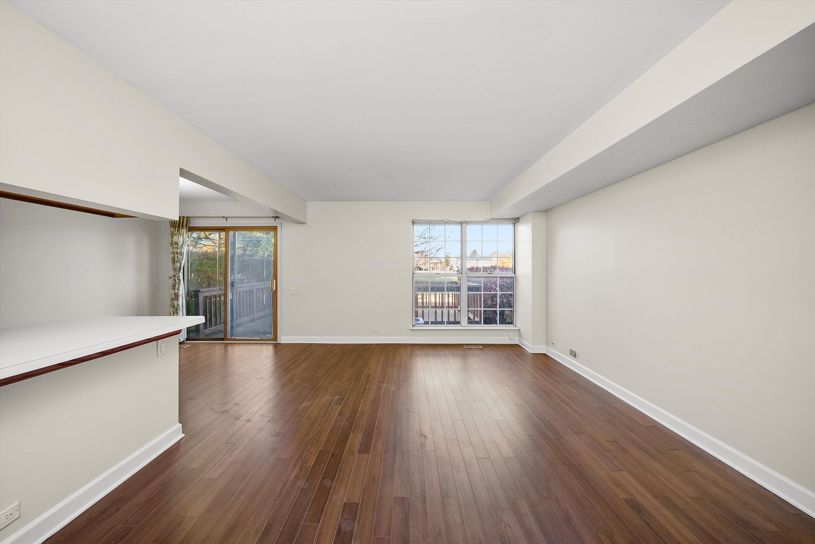 1862 Pebble Beach Circle Elgin, IL 60123 - Photo 2 of 26 an empty room with wooden floor and windows