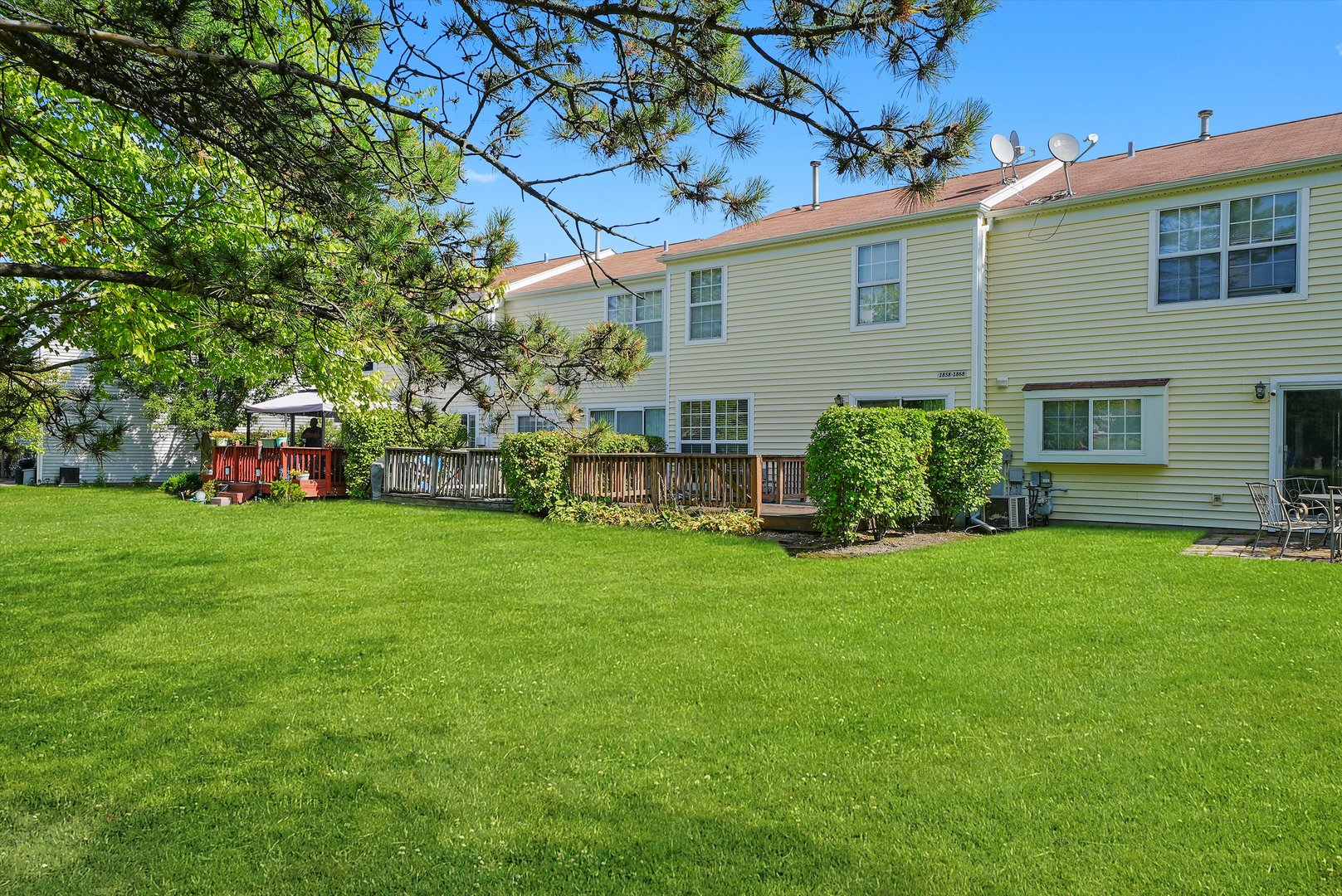 1862 Pebble Beach Circle Elgin, IL 60123 - Photo 22 of 26 a view of a house with a back yard