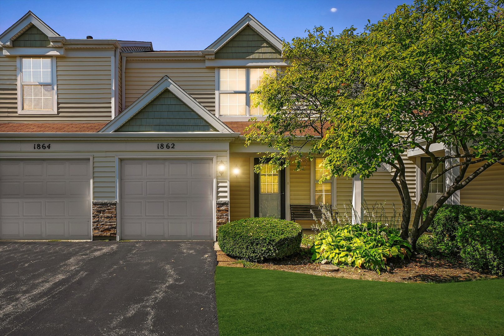 1862 Pebble Beach Circle Elgin, IL 60123 - Photo 26 of 26 a front view of a house with a garden