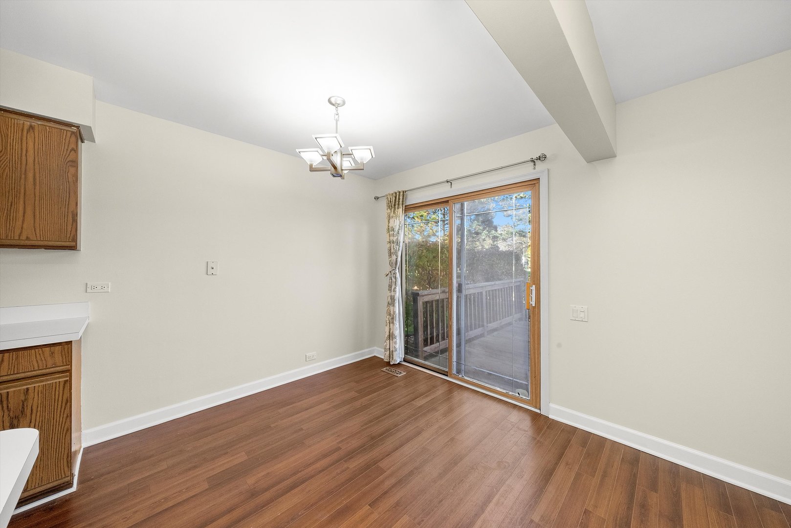 1862 Pebble Beach Circle Elgin, IL 60123 - Photo 7 of 26 wooden floor in an empty room with a window