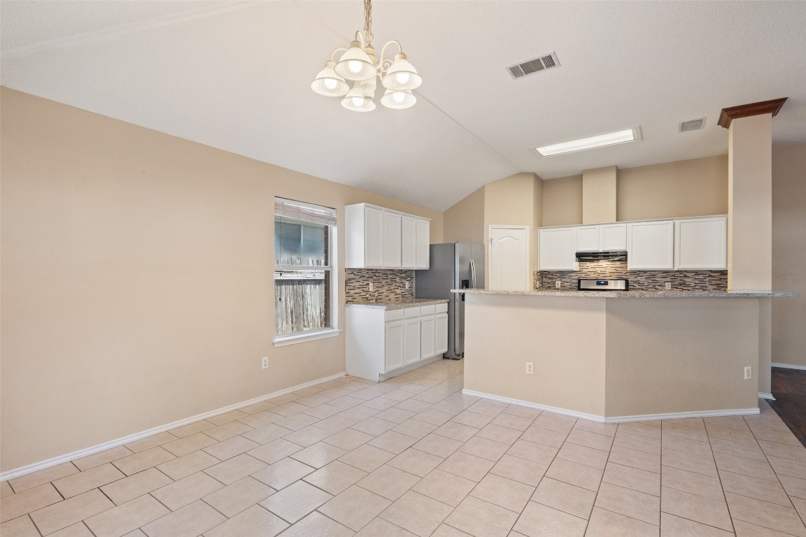 1008 Chippewa Round Rock, TX 78665 - Photo 11 of 36 a kitchen with cabinets and window