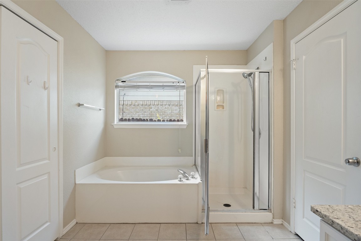 1008 Chippewa Round Rock, TX 78665 - Photo 24 of 36 a bathroom with a bathtub shower and a sink