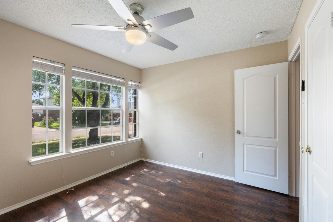1008 Chippewa Round Rock, TX 78665 - Photo 32 of 36 an empty room with wooden floor fan and windows