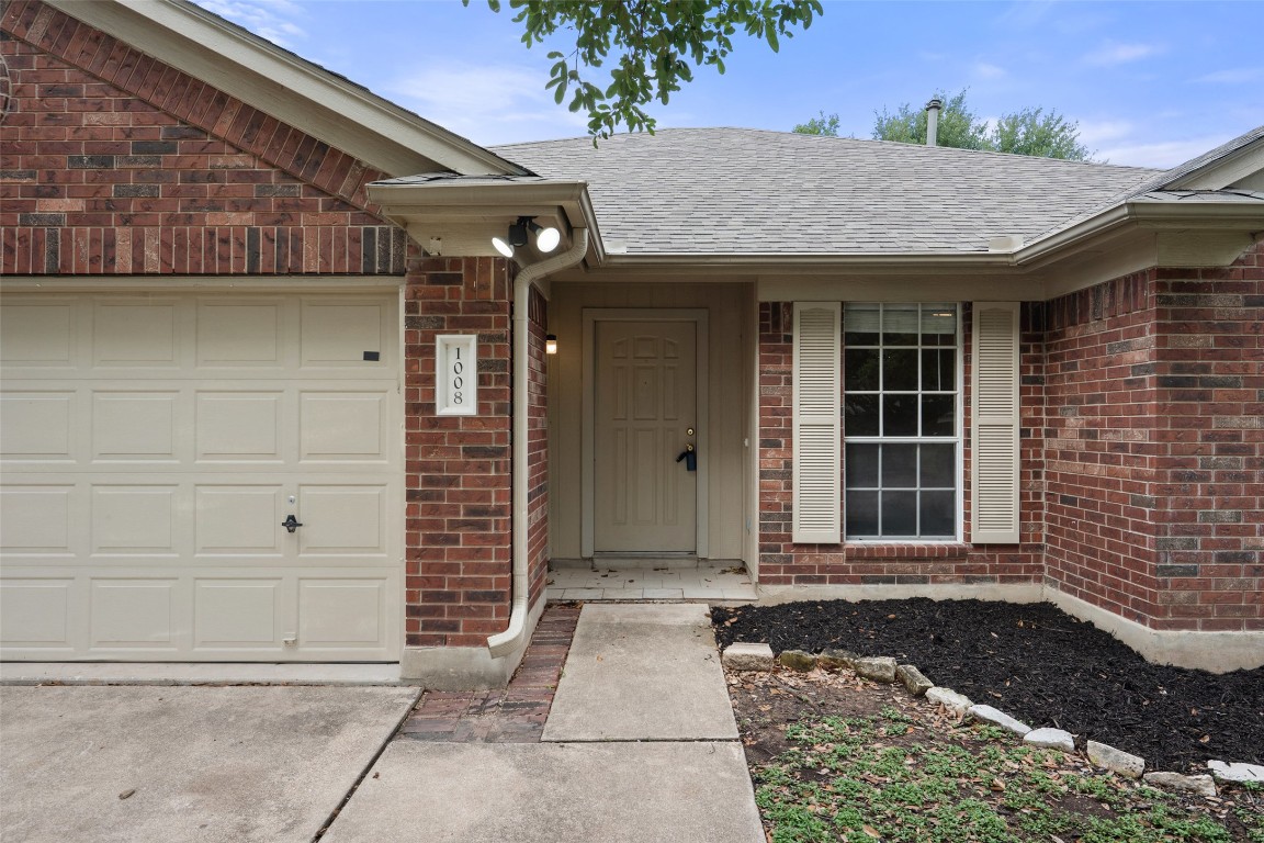 1008 Chippewa Round Rock, TX 78665 - Photo 5 of 36 a view of a house with a door and a large window