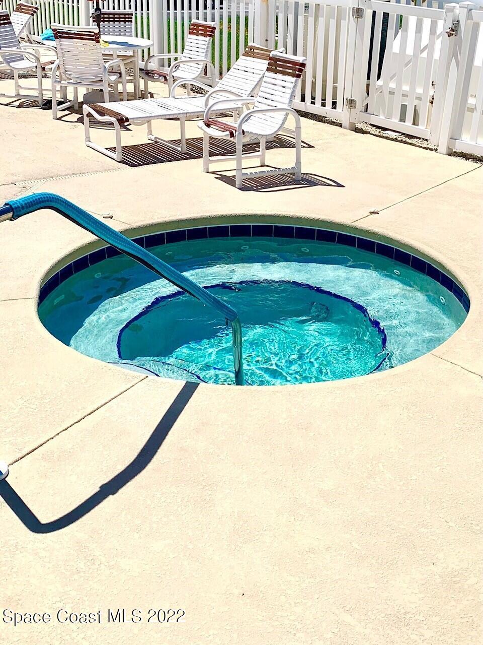 584 North Wickham Road, Unit 82 Melbourne, FL 32935 - Photo 21 of 43 a view of a swimming pool with a stove