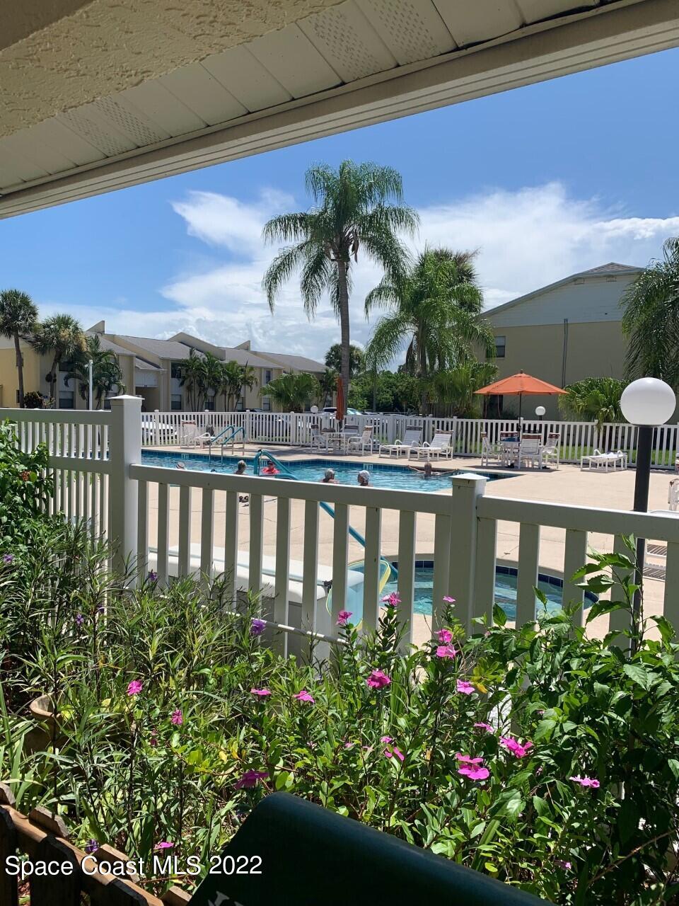 584 North Wickham Road, Unit 82 Melbourne, FL 32935 - Photo 24 of 43 a view of a chairs and table in the balcony