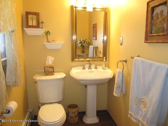 8 Bunkerhill Road Hazlet, NJ 07730 - Photo 12 of 22 a bathroom with a sink mirror toilet and shower