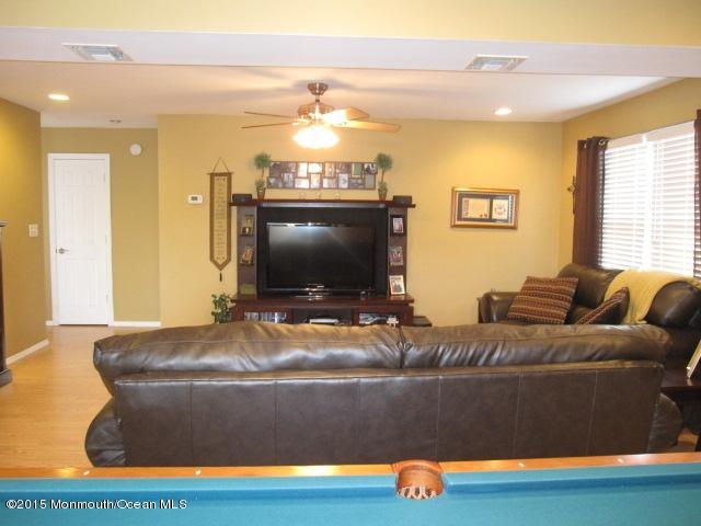 8 Bunkerhill Road Hazlet, NJ 07730 - Photo 15 of 22 a living room with furniture and a flat screen tv