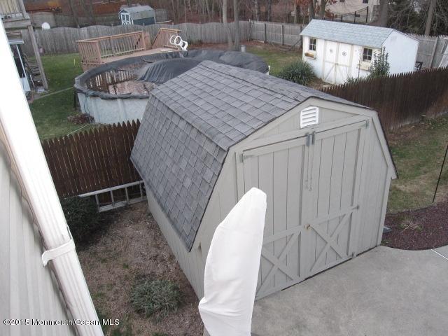 8 Bunkerhill Road Hazlet, NJ 07730 - Photo 17 of 22 a view of a dinning table and chairs in patio