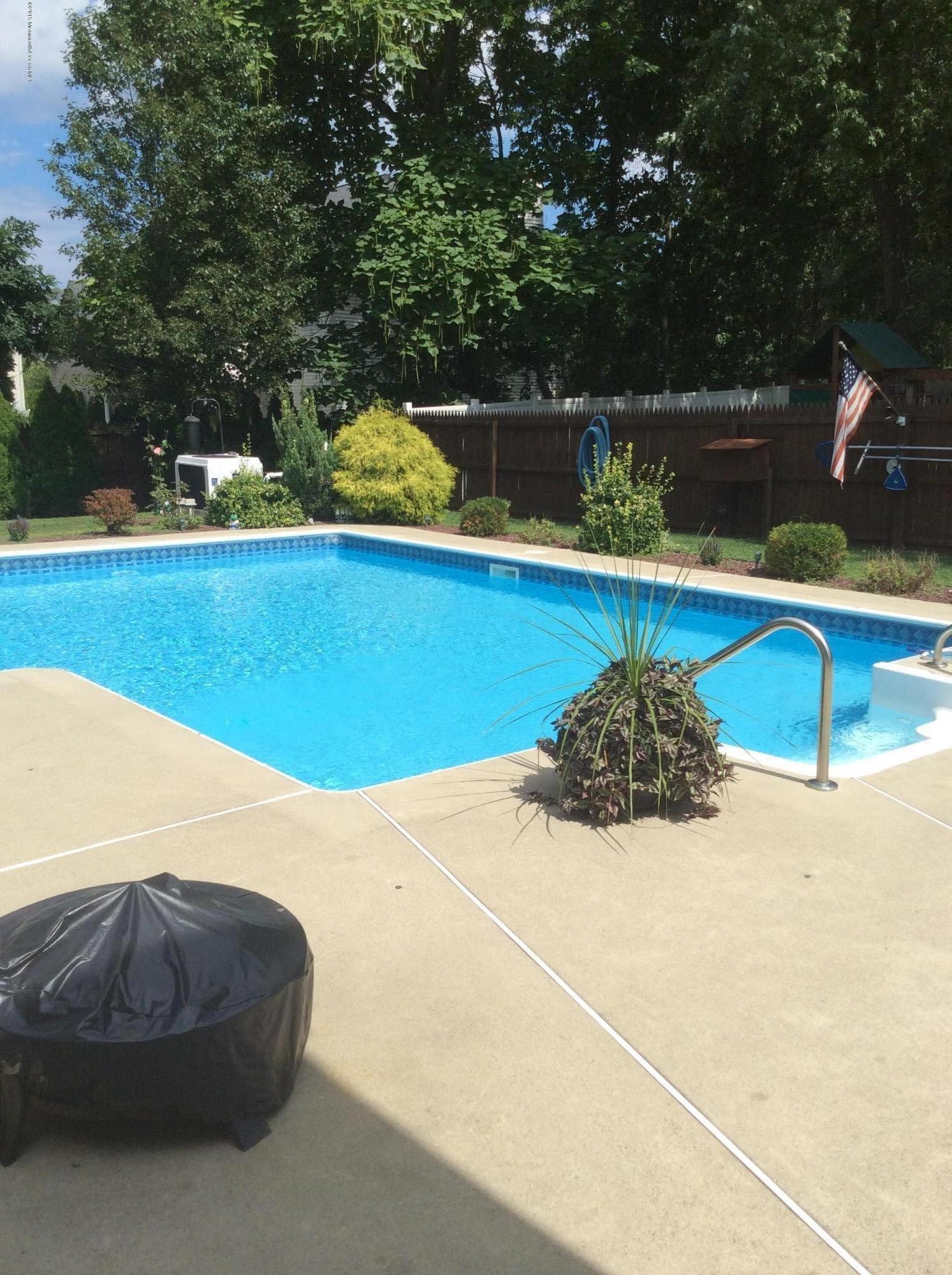 8 Bunkerhill Road Hazlet, NJ 07730 - Photo 20 of 22 a view of swimming pool with a yard