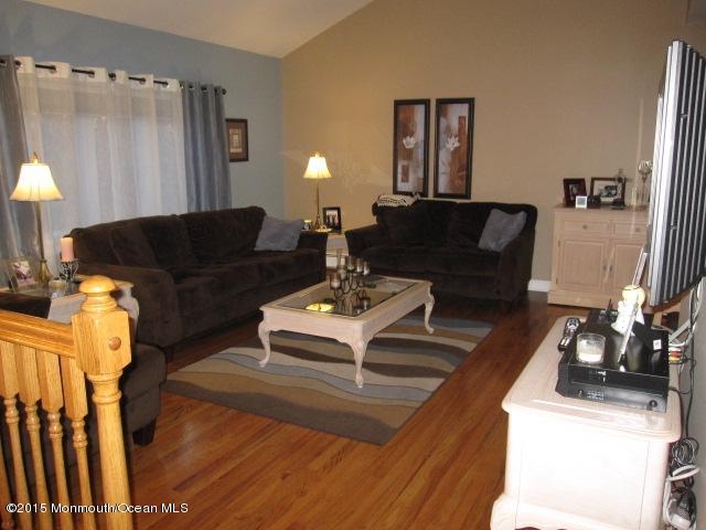 8 Bunkerhill Road Hazlet, NJ 07730 - Photo 2 of 22 a living room with furniture and a lamp