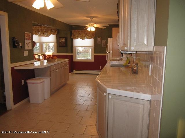 8 Bunkerhill Road Hazlet, NJ 07730 - Photo 6 of 22 a bathroom with a sink and a mirror