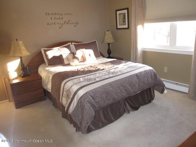 8 Bunkerhill Road Hazlet, NJ 07730 - Photo 8 of 22 a bedroom with a bed and window