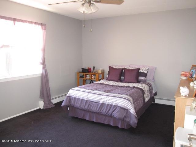 8 Bunkerhill Road Hazlet, NJ 07730 - Photo 10 of 22 a bedroom with a bed and a window