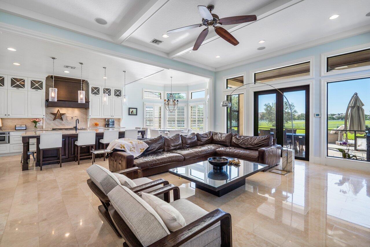 9891 Equus Circle Boynton Beach, FL 33472 - Photo 17 of 88 a living room with furniture kitchen view and a large window