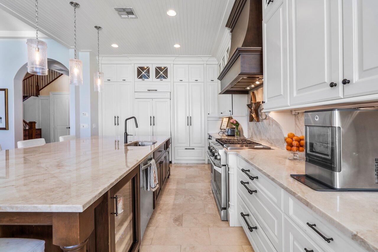 9891 Equus Circle Boynton Beach, FL 33472 - Photo 20 of 88 a kitchen with stainless steel appliances granite countertop a sink a stove and a refrigerator