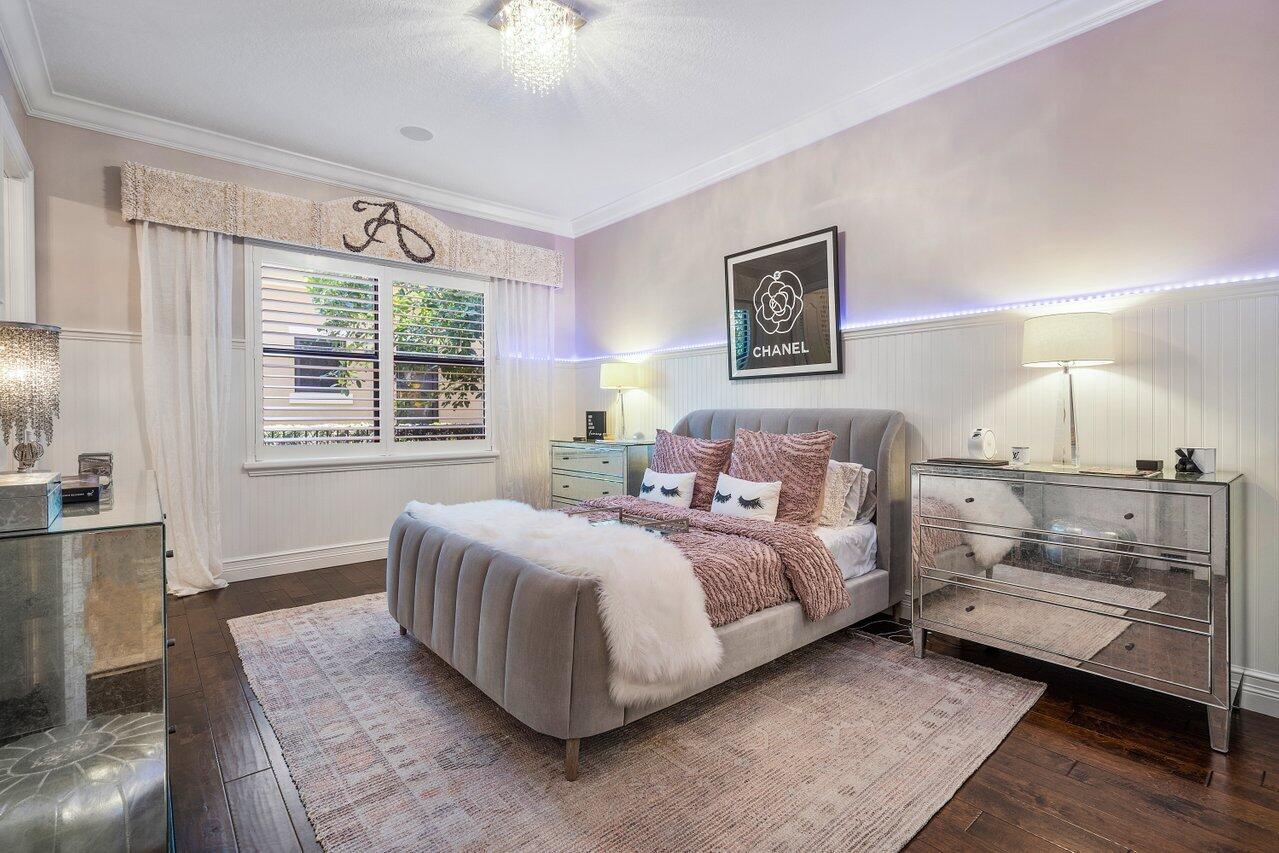 9891 Equus Circle Boynton Beach, FL 33472 - Photo 37 of 88 a spacious bedroom with a bed and a couch