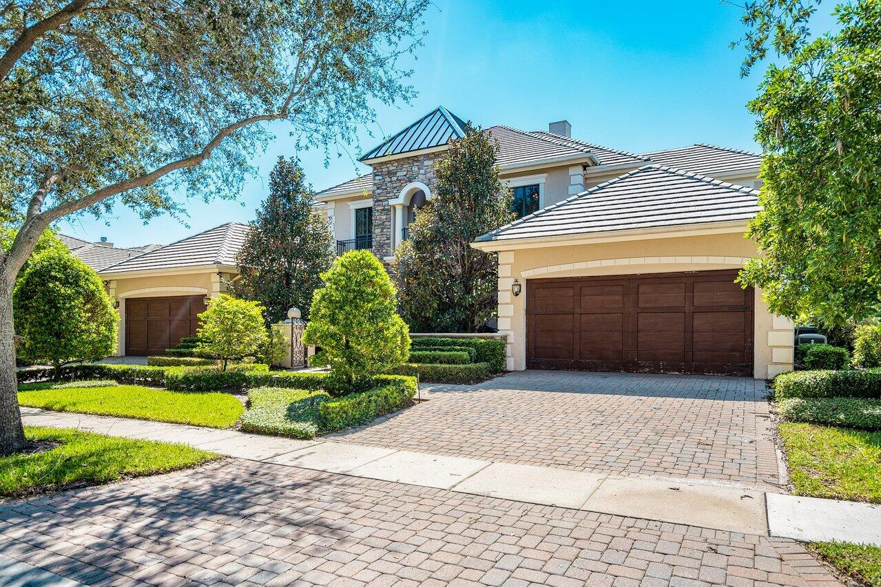 9891 Equus Circle Boynton Beach, FL 33472 - Photo 6 of 88 a front view of a house with a yard and garage