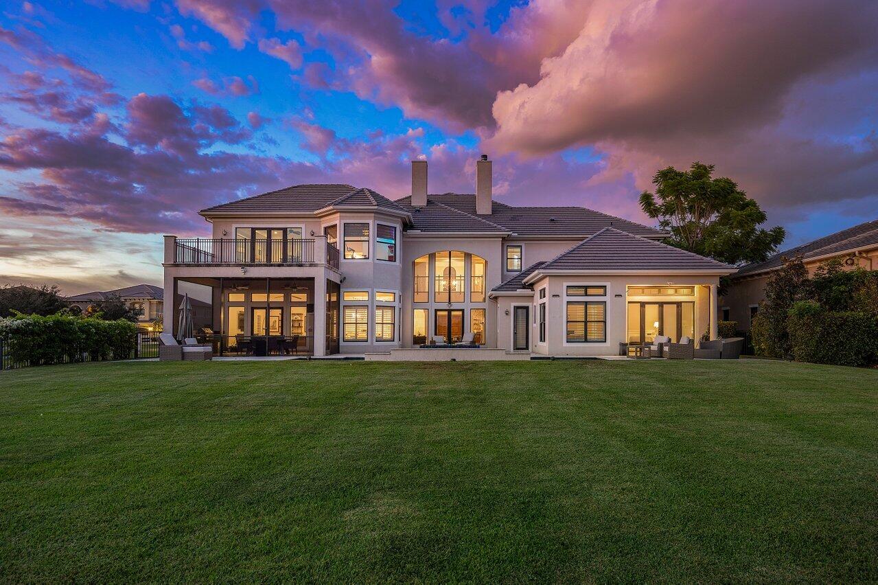 9891 Equus Circle Boynton Beach, FL 33472 - Photo 68 of 88 a front view of a house with a garden