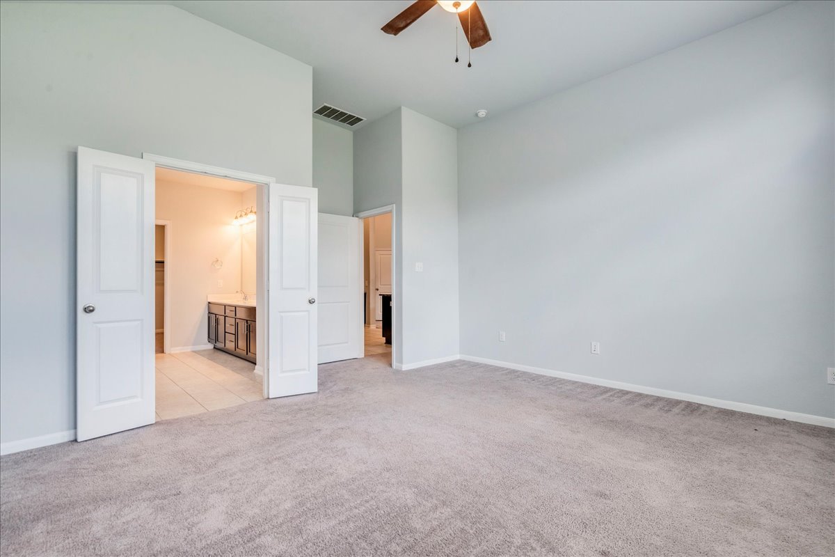275 Cherrystone Loop Buda, TX 78610 - Photo 18 of 33 Primary bedroom