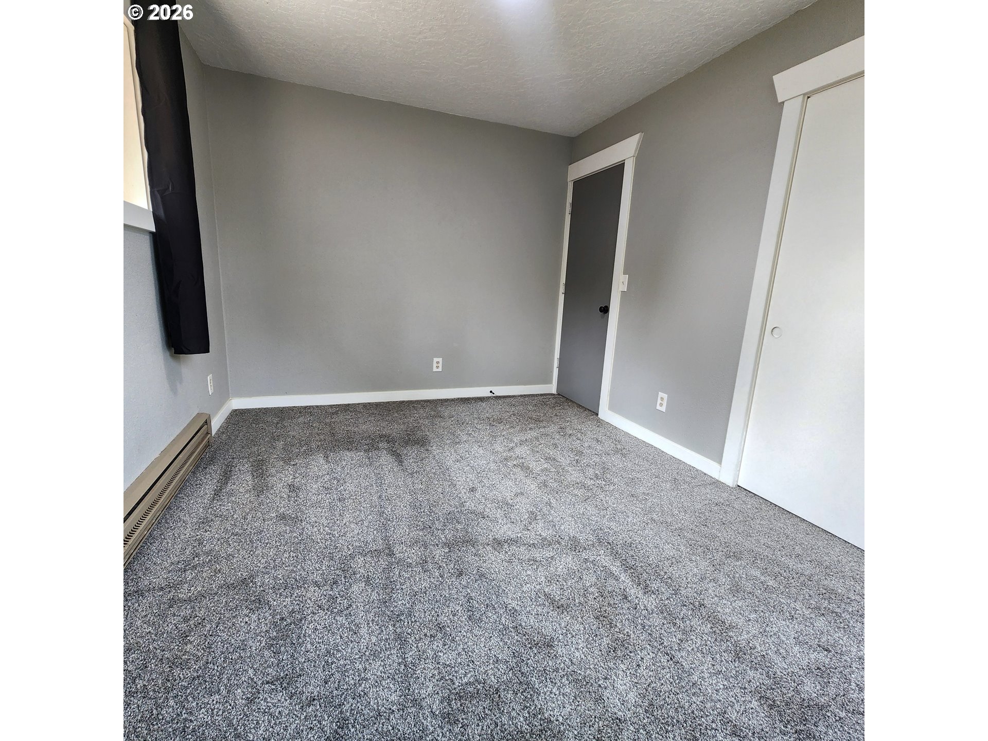54047 West Lane Road Scappoose, OR 97056 - Photo 12 of 44 a view of room with window and hardwood floor